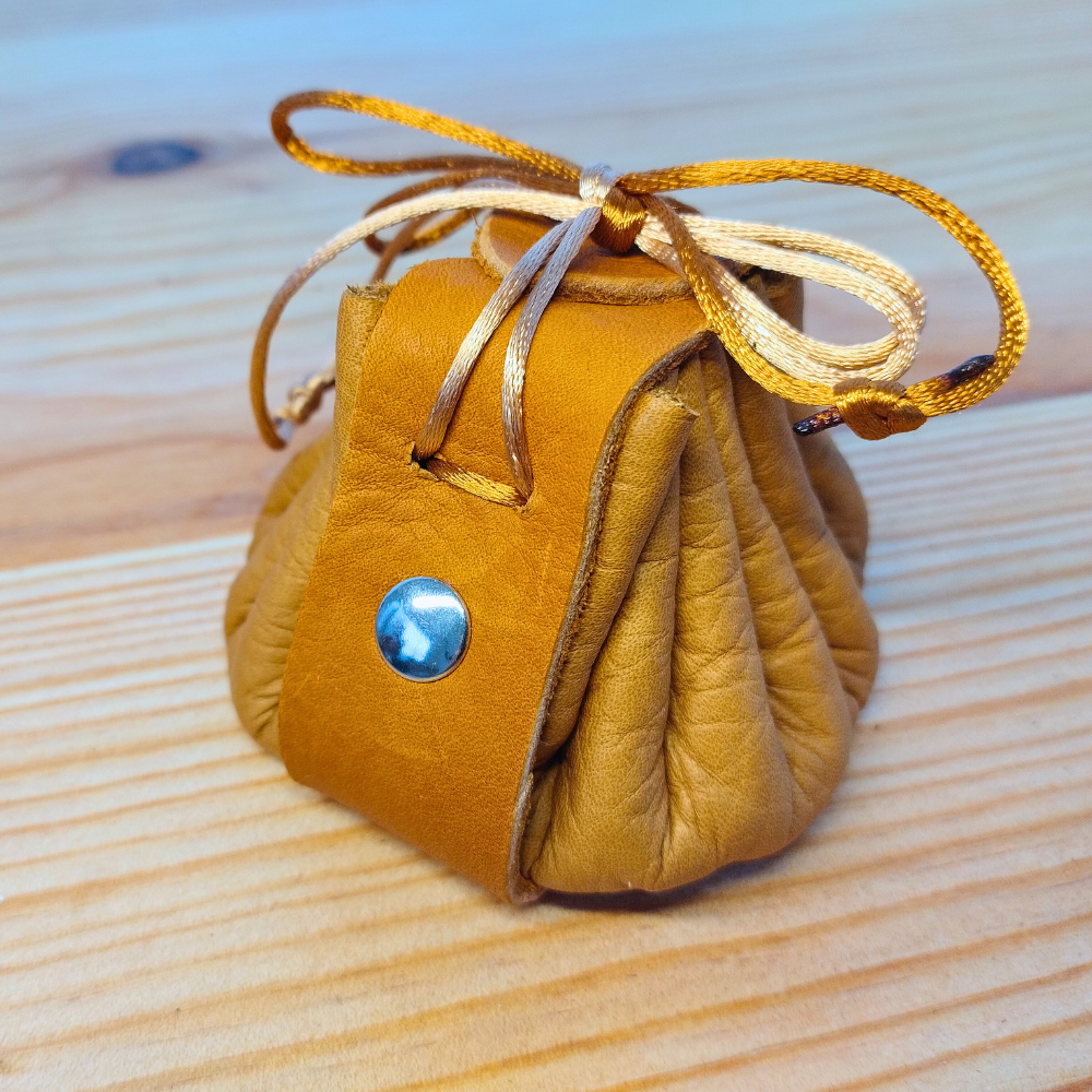 small leather pouch with silver rivets
